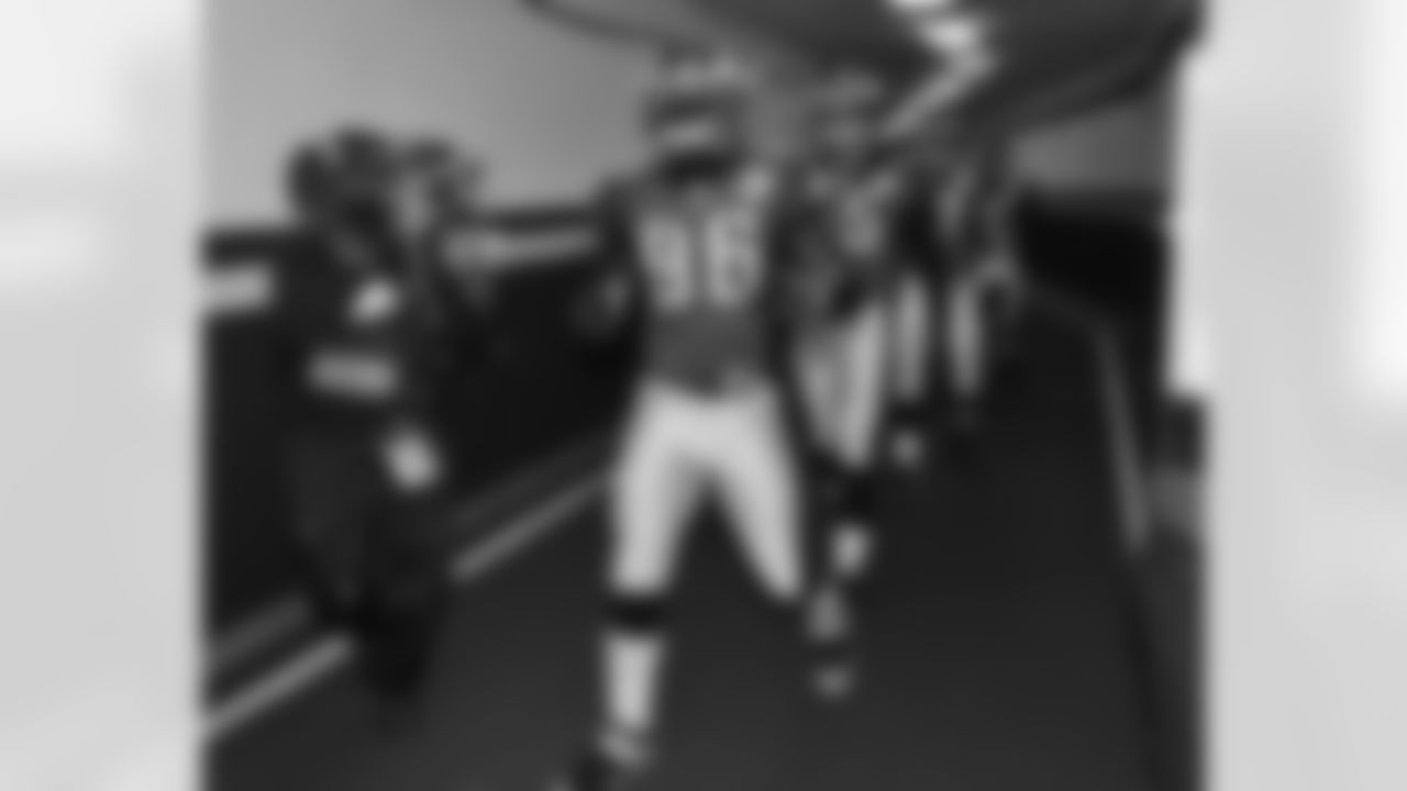 LB Omar Gaither leads the Eagles out of the player tunnel