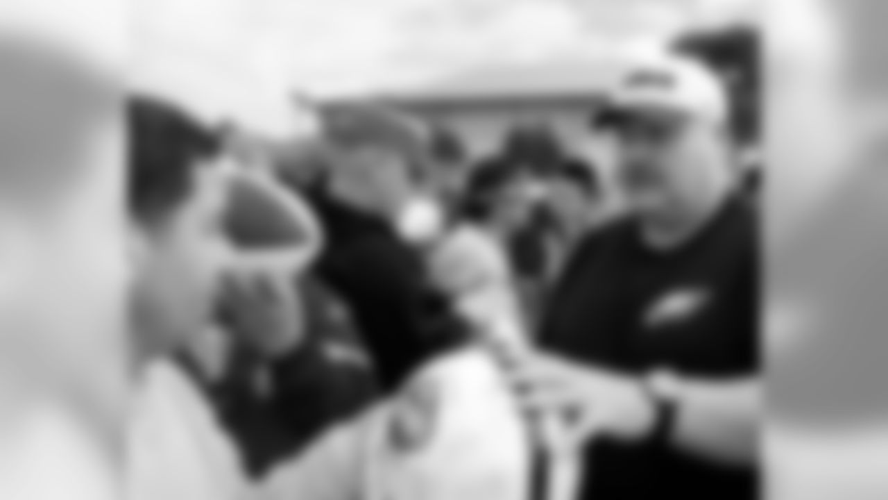 Head coach Andy Reid signed autographs after practice