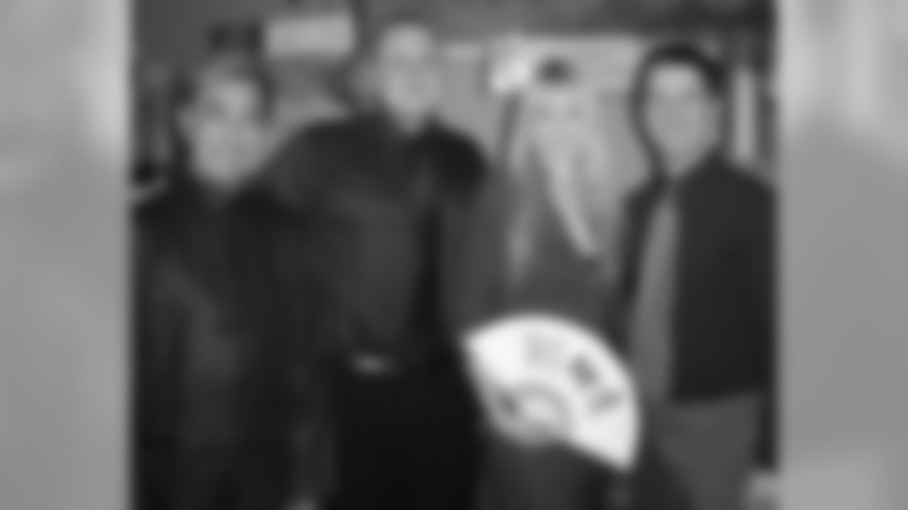Barbara Zaun, Eagles Television Network's Chris Ubbens and Joe Helder with one of the Hong Kong representatives