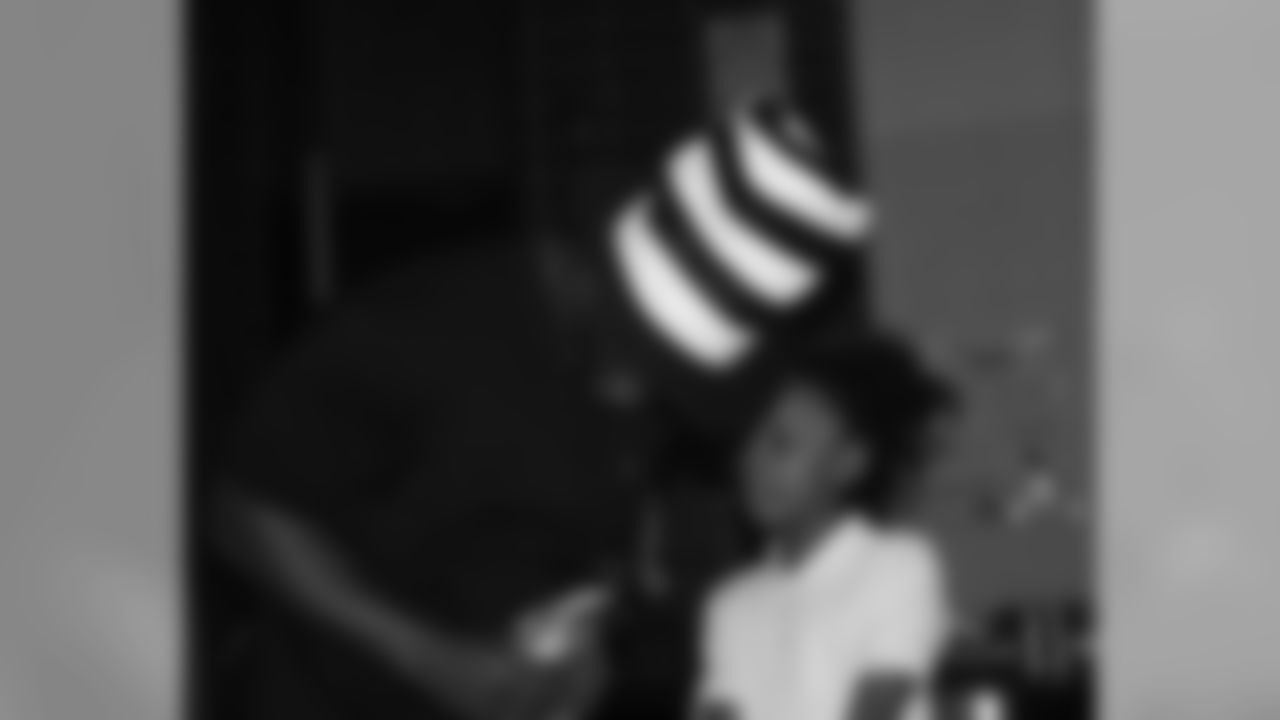 Omar listens to a students' request