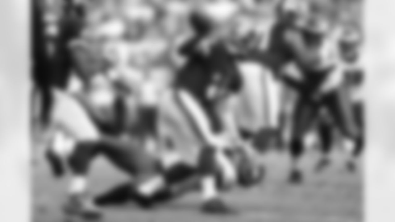 QB Robert Griffin III gets rid of the ball to avoid a sack