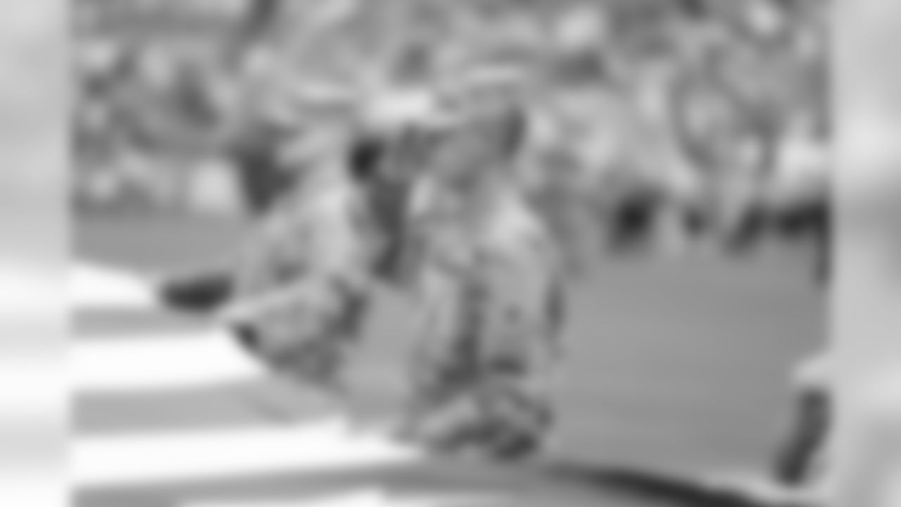 Soldiers hold the American Flag during the National Anthem.