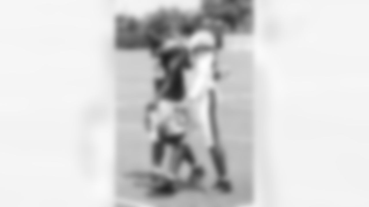 Two veterans- LeSean McCoy and DeMeco Ryans- head back to the locker room after practice