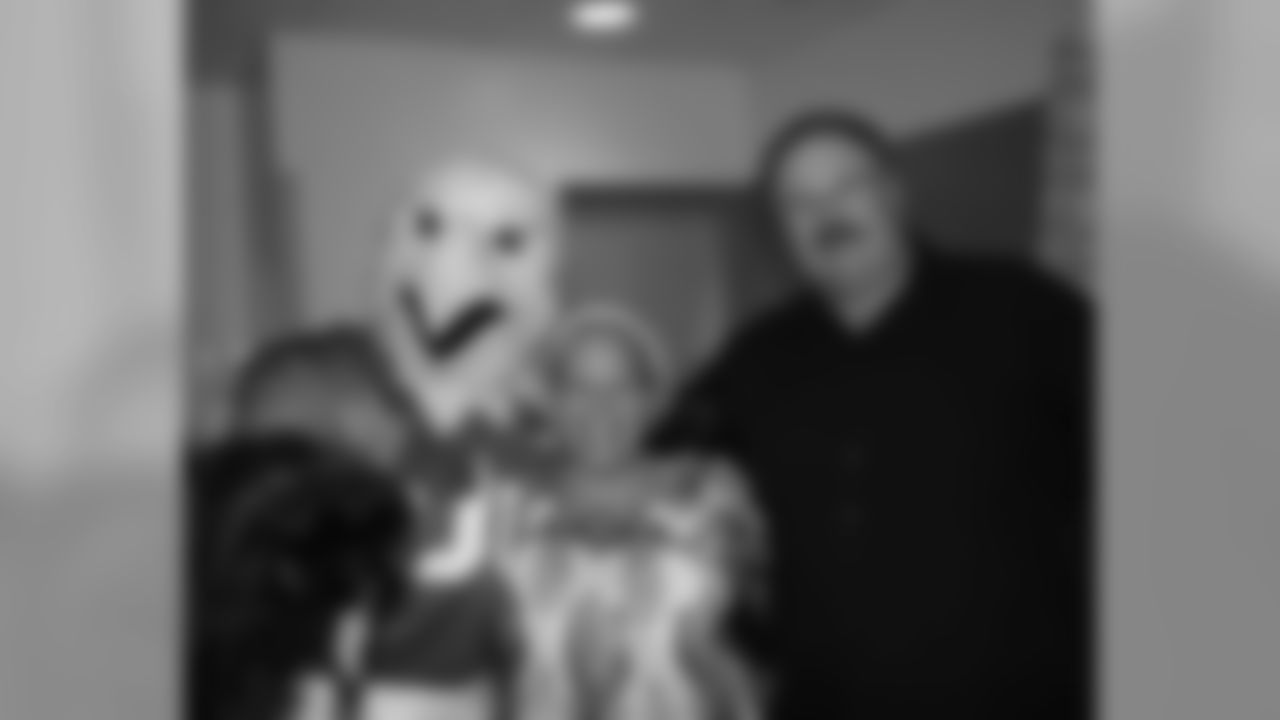 Andy Reid and SWOOP pose with mother of patient