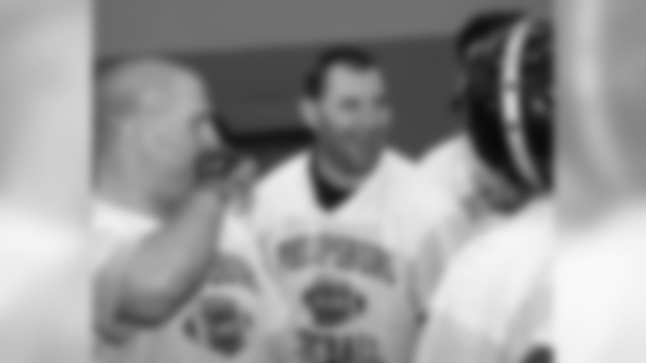 Members of the 1993 football team from Phillipsburg High School share a laugh
