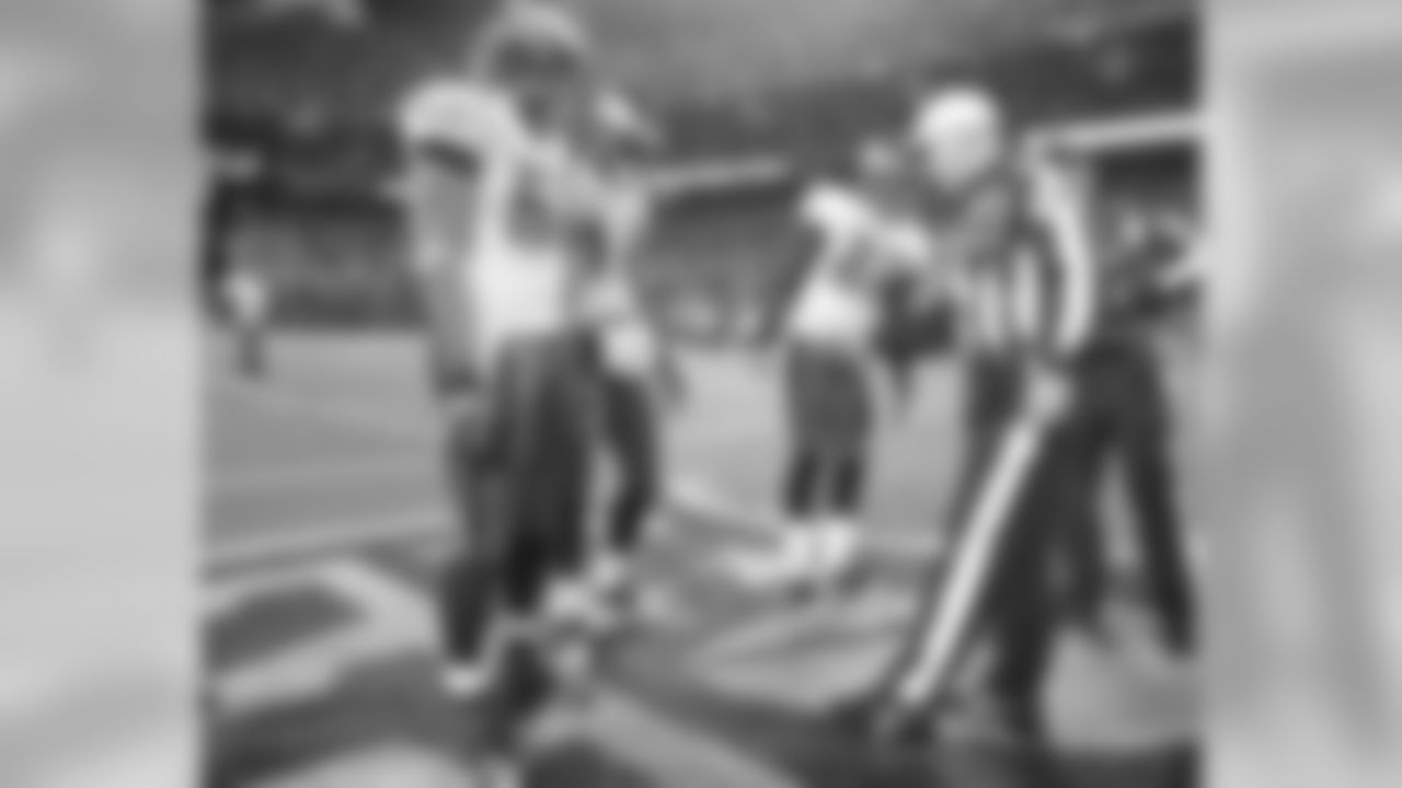 Eagles game captains watch the coin flip