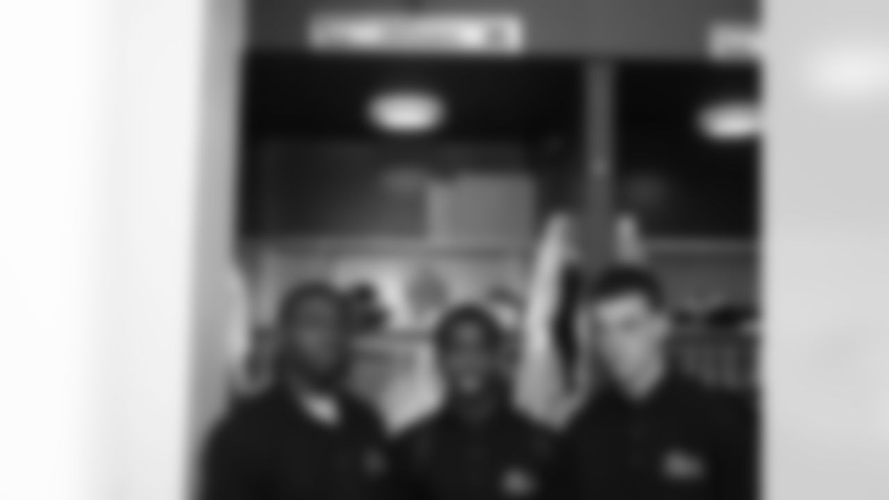 These Top Achievers stop for a photo by WR DeSean Jackson's locker