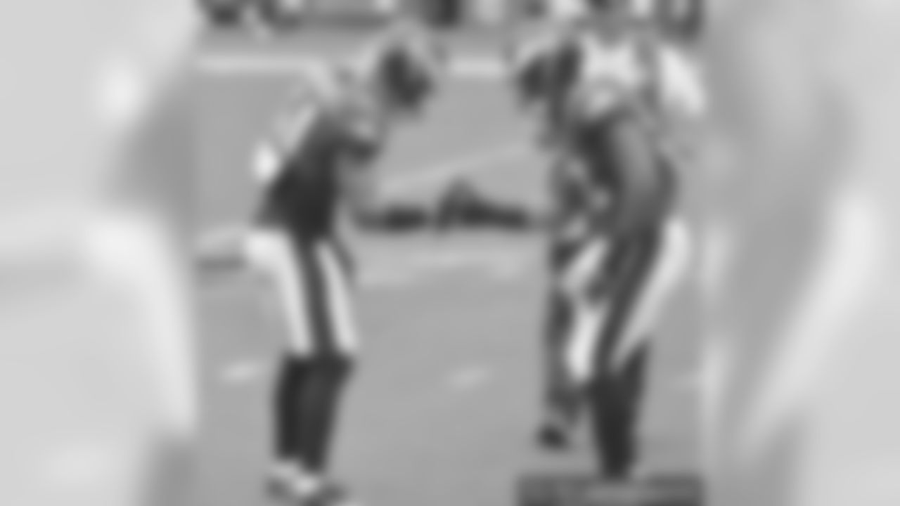 Kamu Grugier-Hill and Najee Goode dapping it up during the game against the Cardinals.