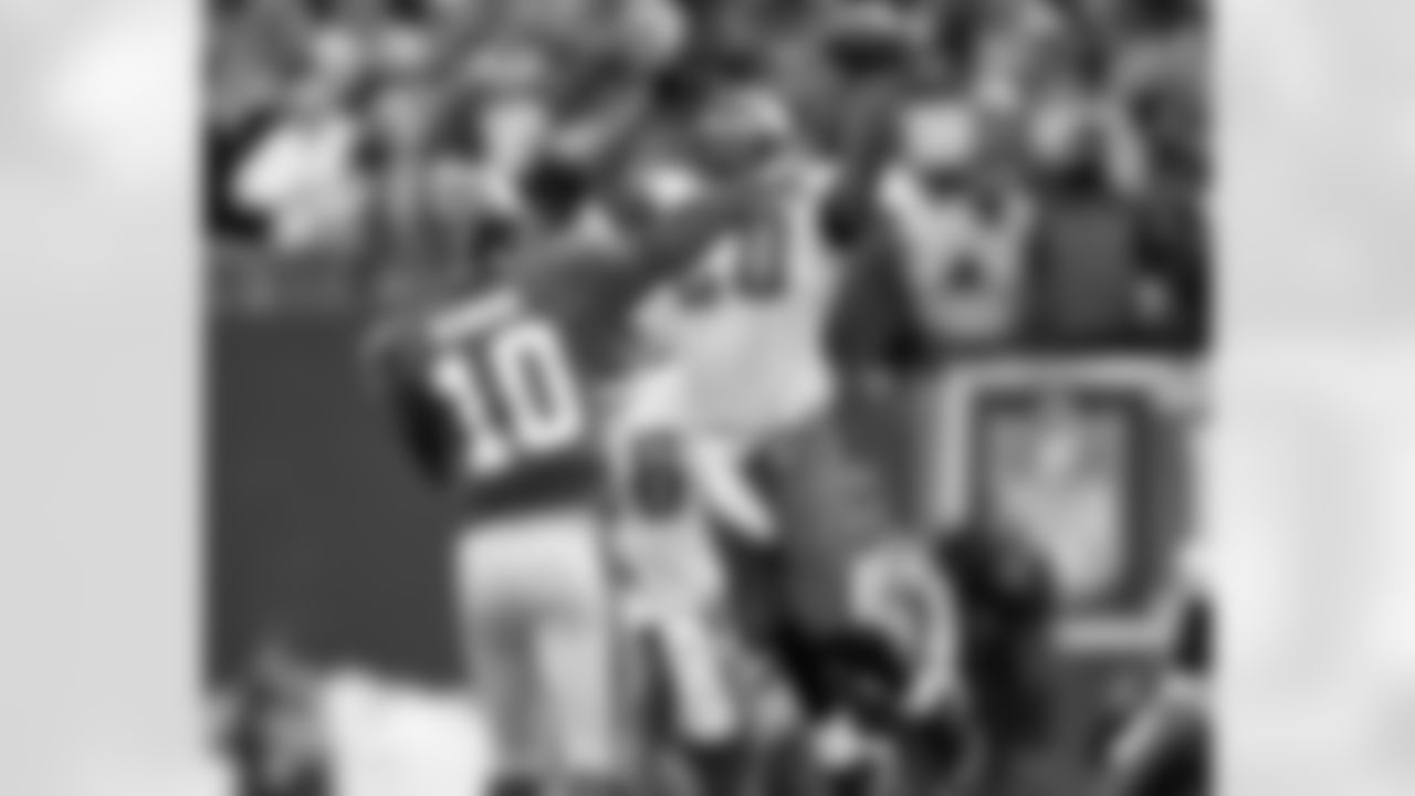 FS Brian Dawkins looks to block a pass by Giants QB Eli Manning