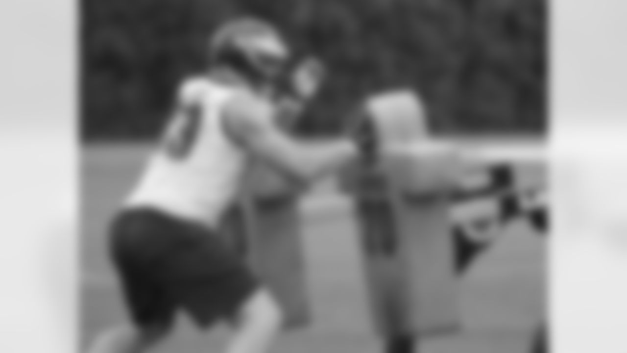 DE Brandon Bair shows off his strength