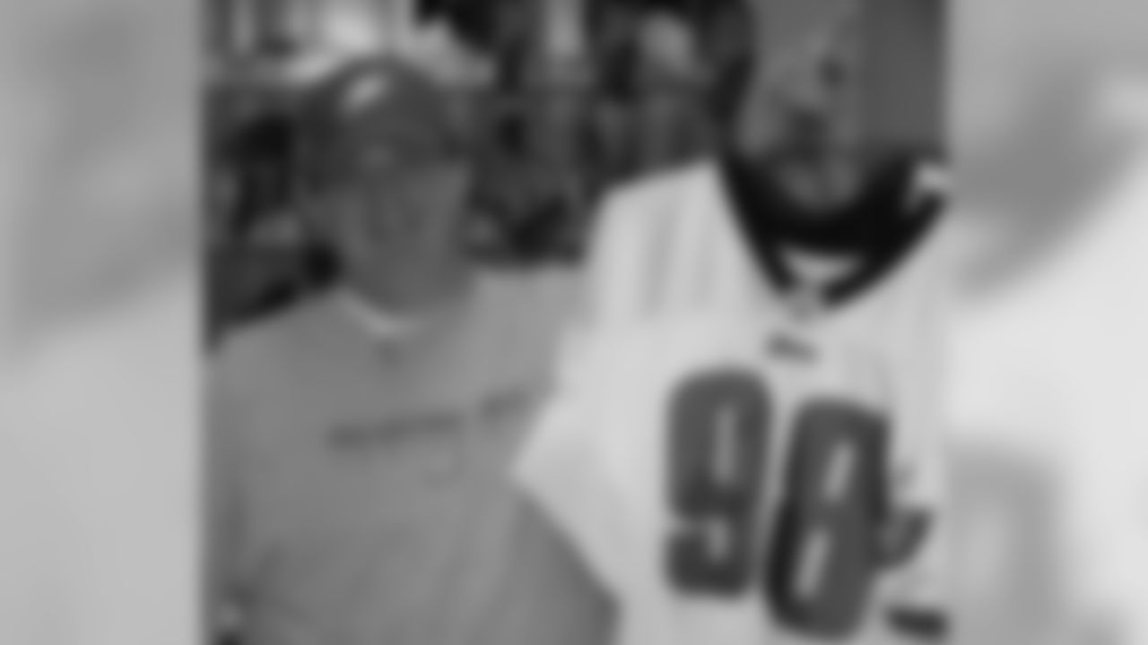 Equipment Assistant Kenny Slough displays some jerseys