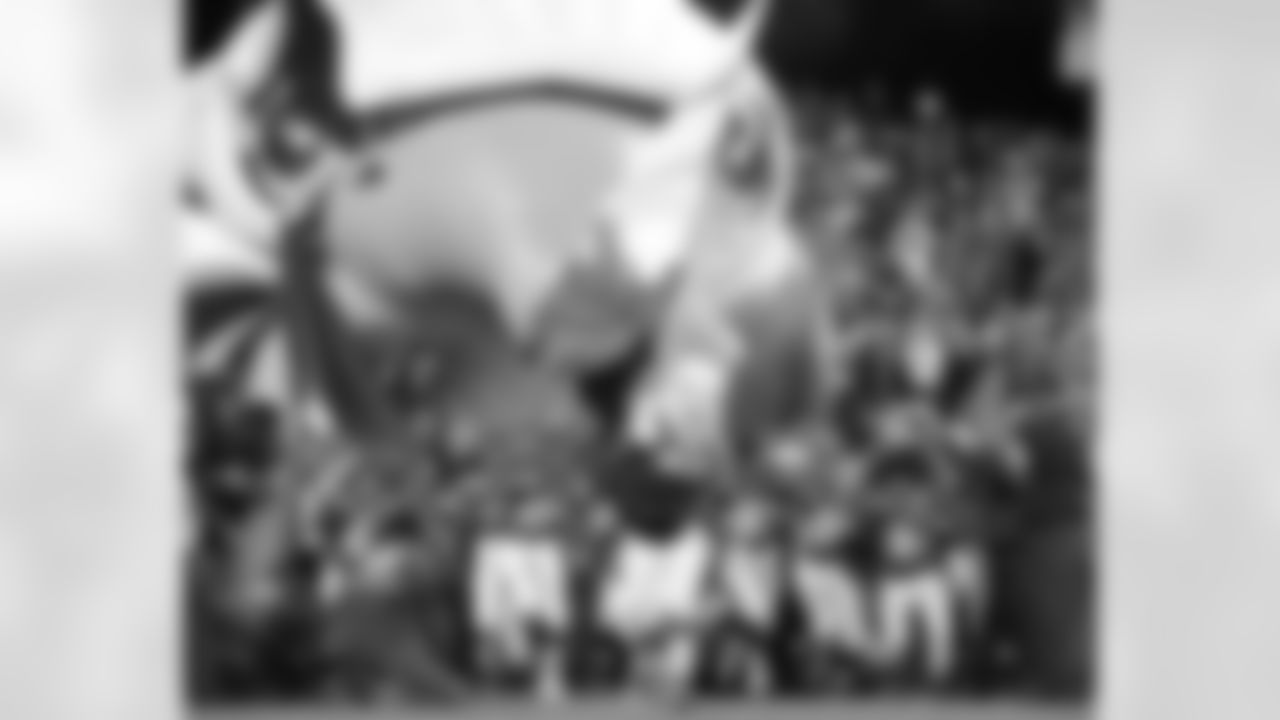 SWOOP and the Frankford Chargers Pop Warner football team led the players onto the field at Thursday's game