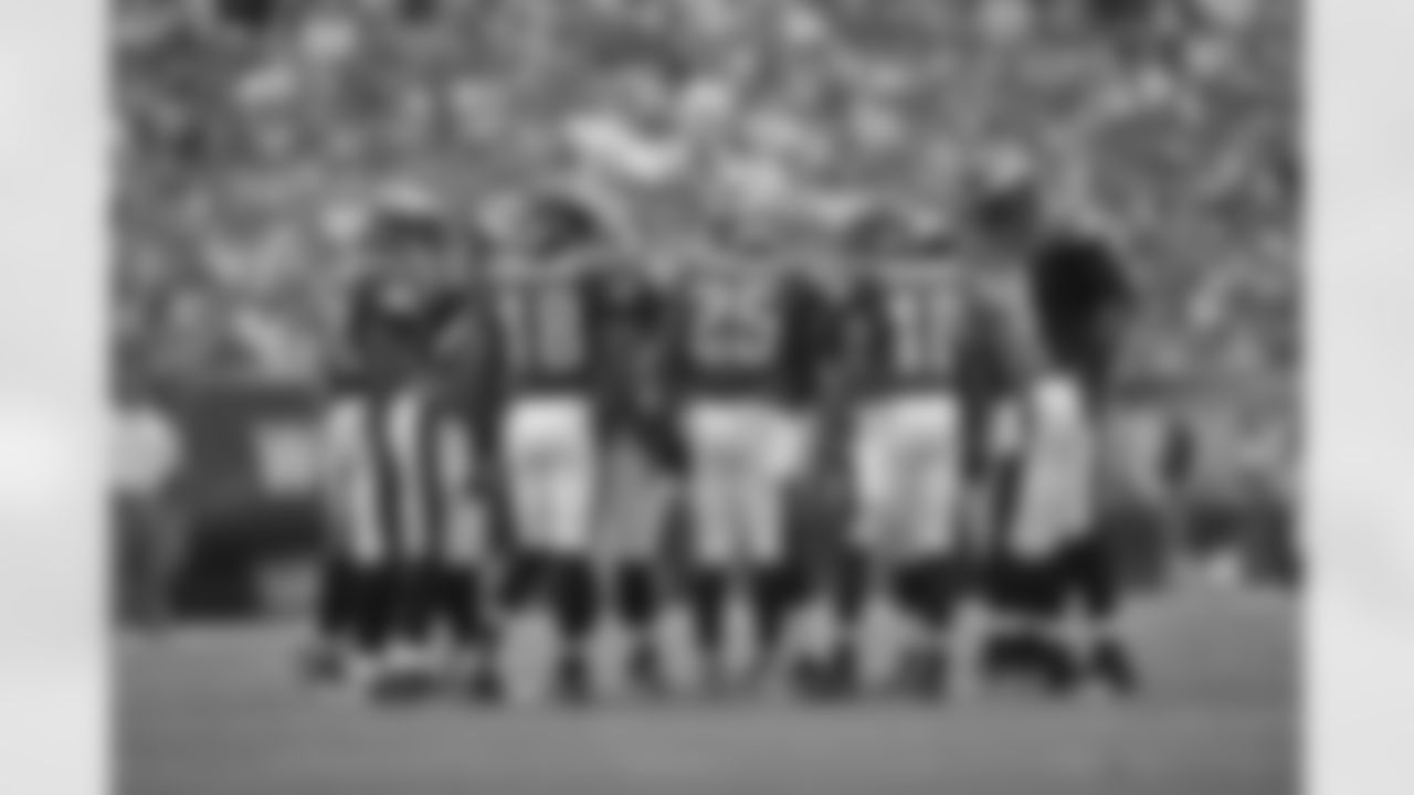 The Offense Huddles