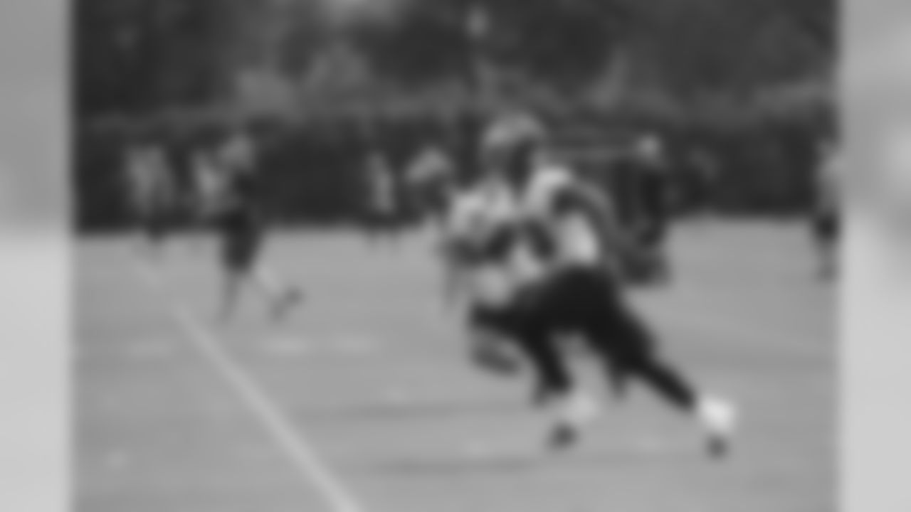 LBs Kiko Alonso and Najee Goode race towards the ball