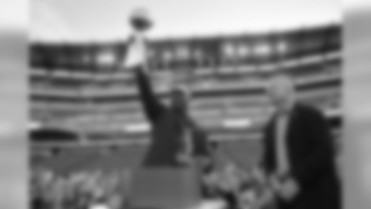 Brian Dawkins holds up the Lombardi Trophy for everyone to see.