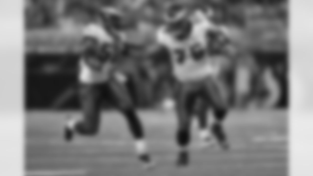 DE Juqua runs after recovering a fumble
