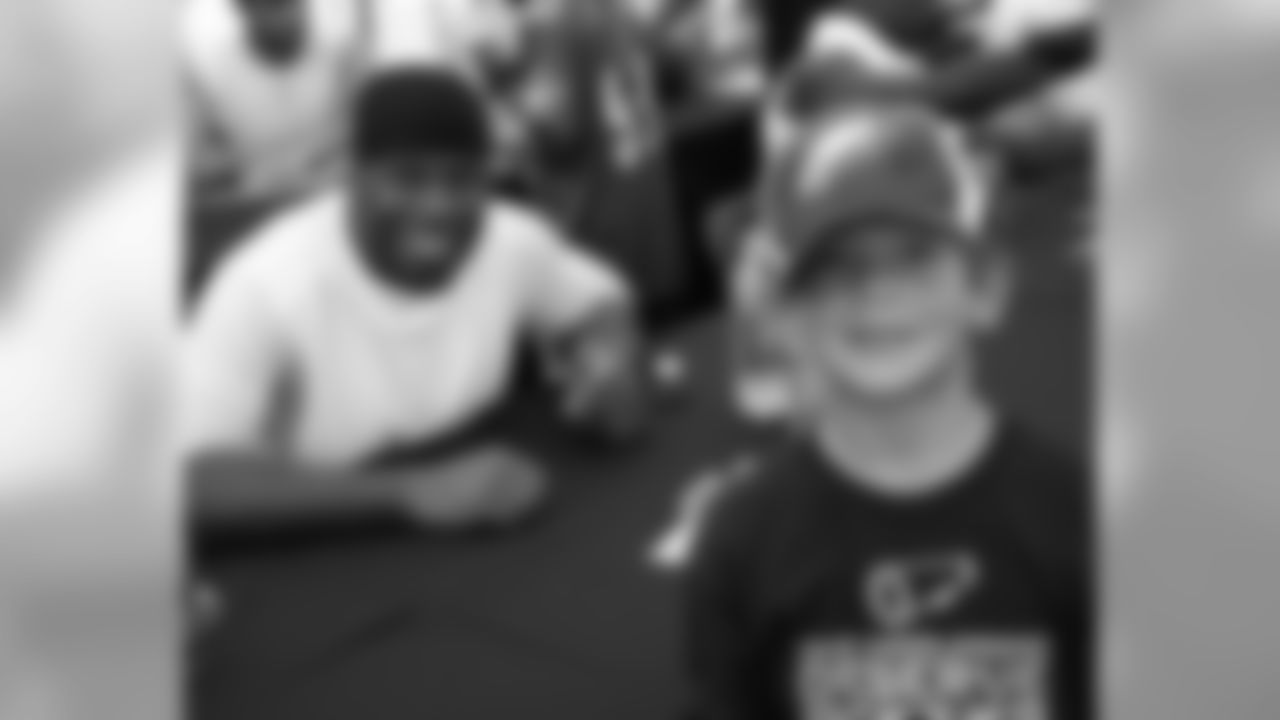 SS Quintin Mikell takes time for a photo with this fan inside the Autograph Tent