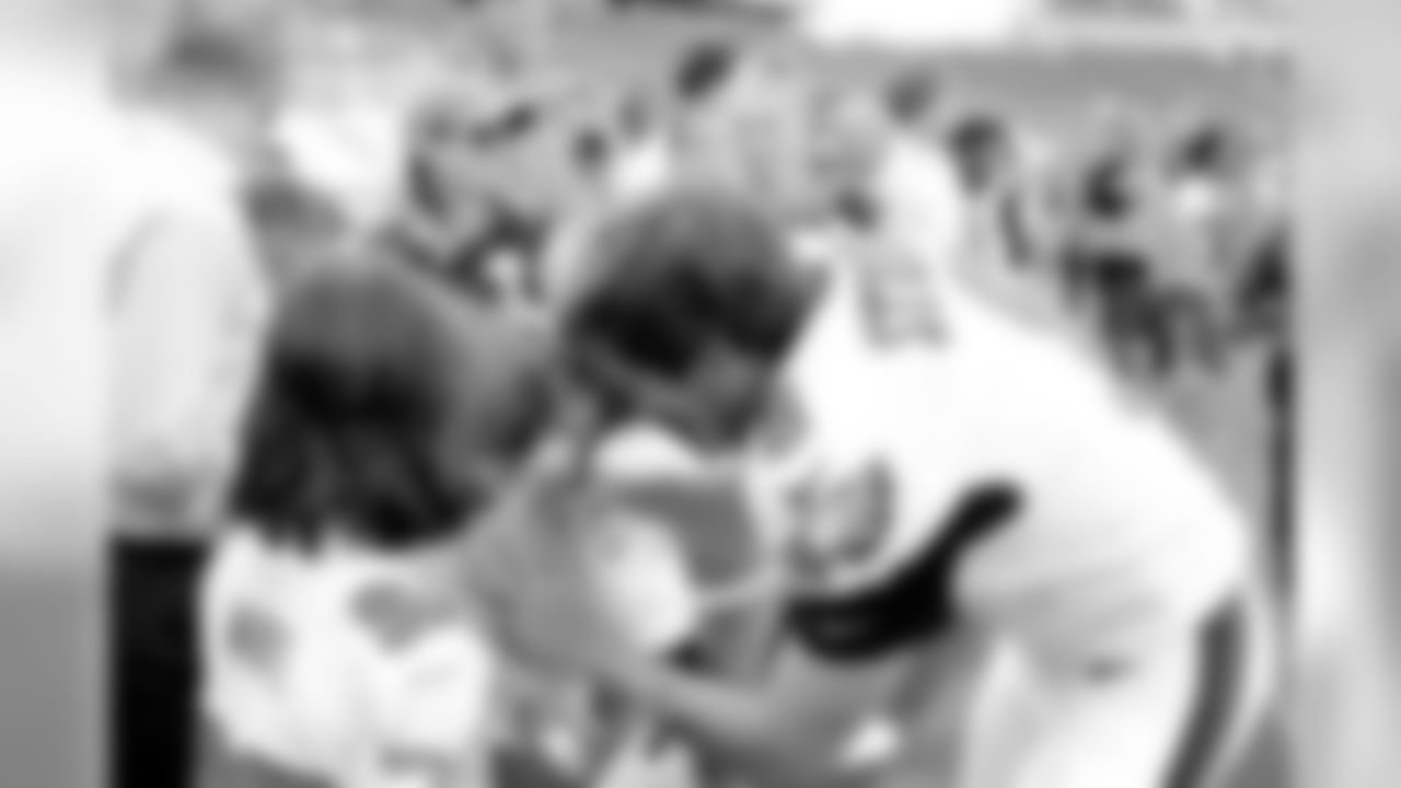 K Caleb Sturgis signs an autograph for a fan