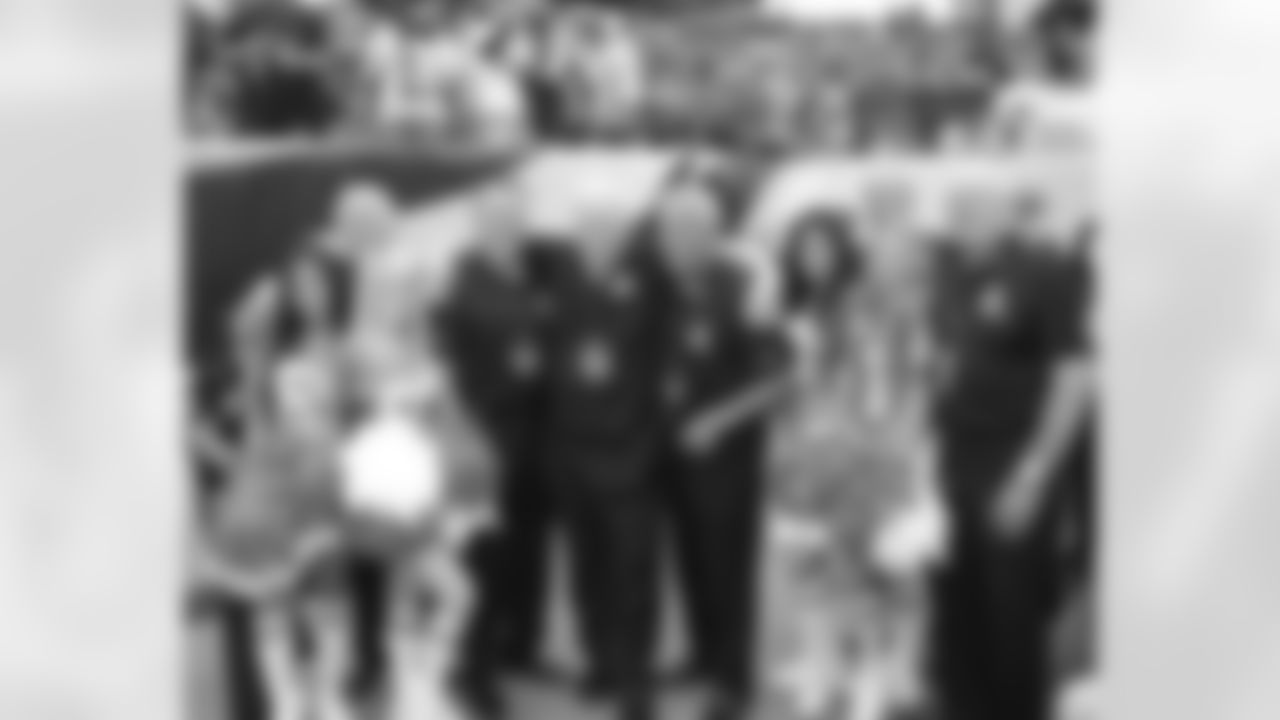 The Eagles Cheerleaders with members of the 1960 Championship Eagles Team