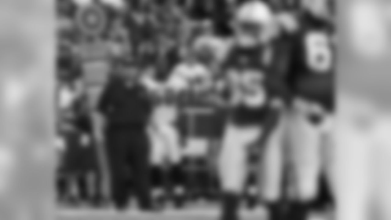 Head coach Andy Reid and LB Tank Daniels look on