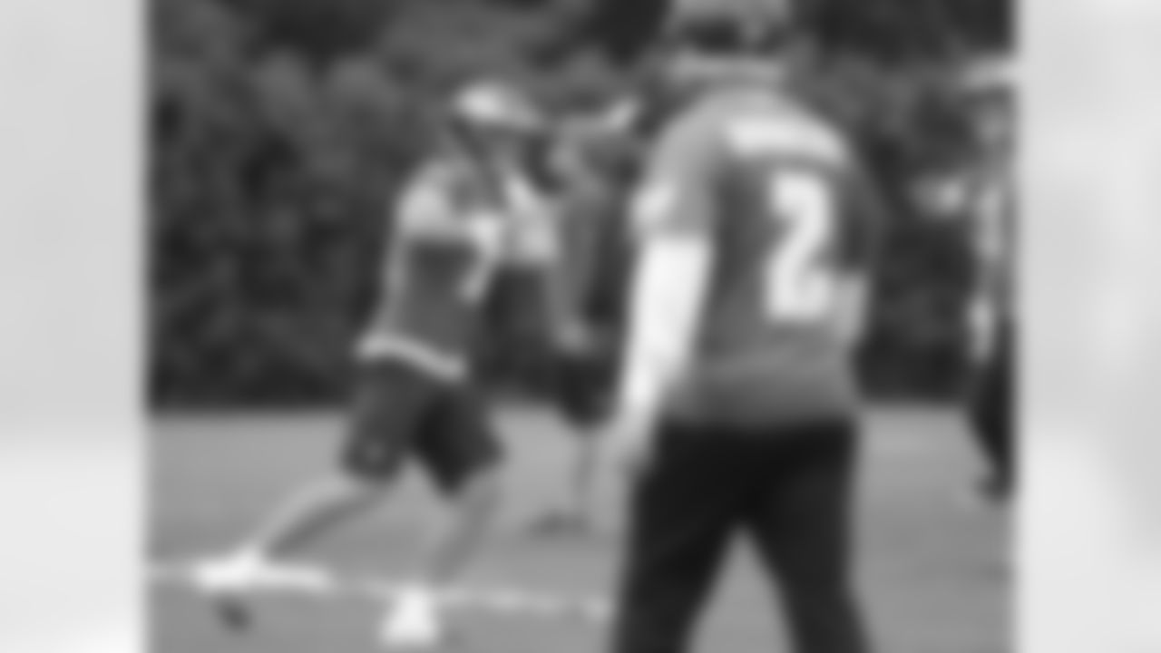 QB Tim Tebow runs a passing drill