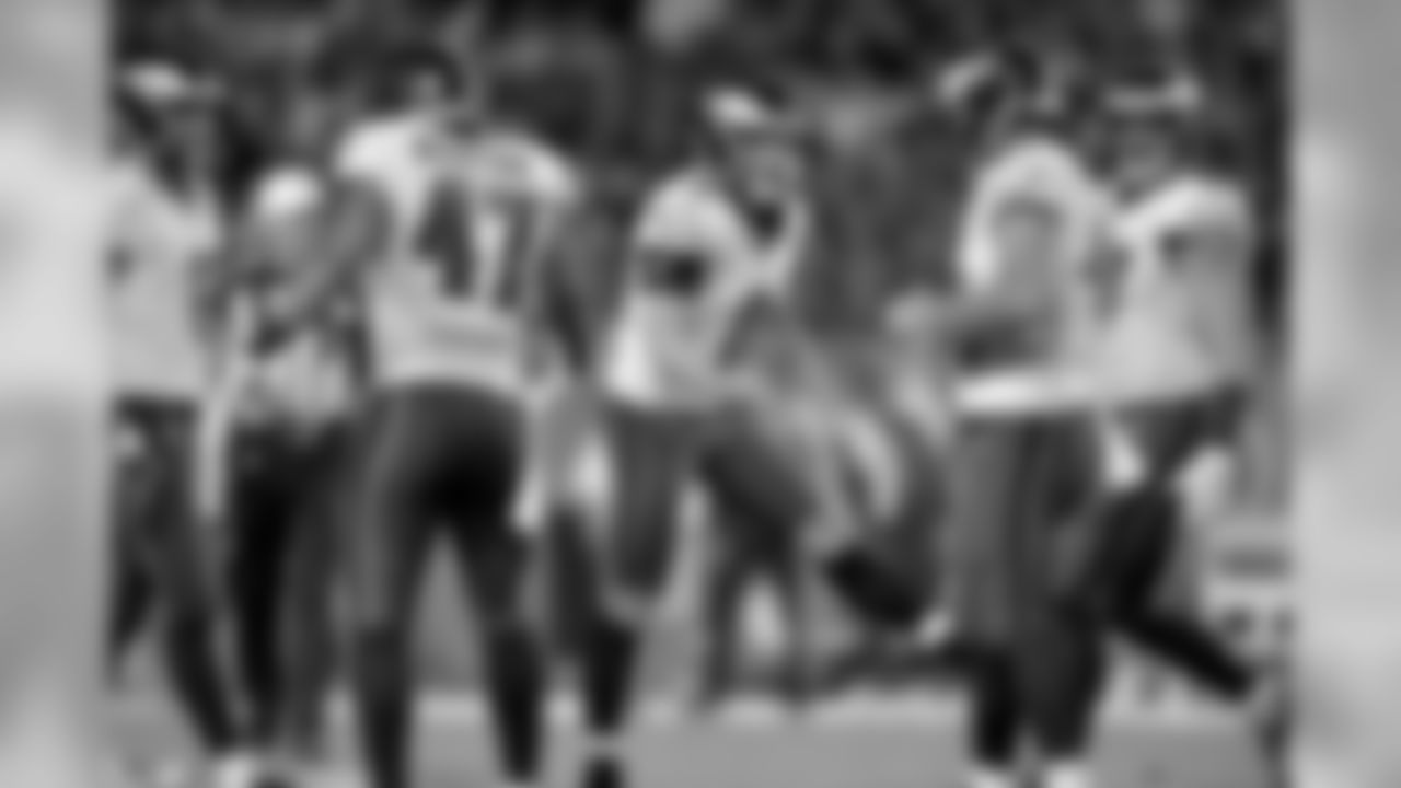 TE Trey Burton, K Caleb Sturgis, and LS Jon Dorenbos