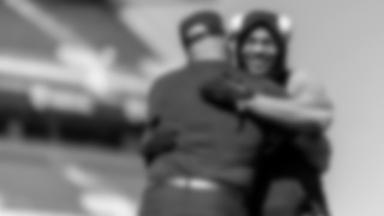 D'Andre Swift and Jemal Singleton hug before the game.