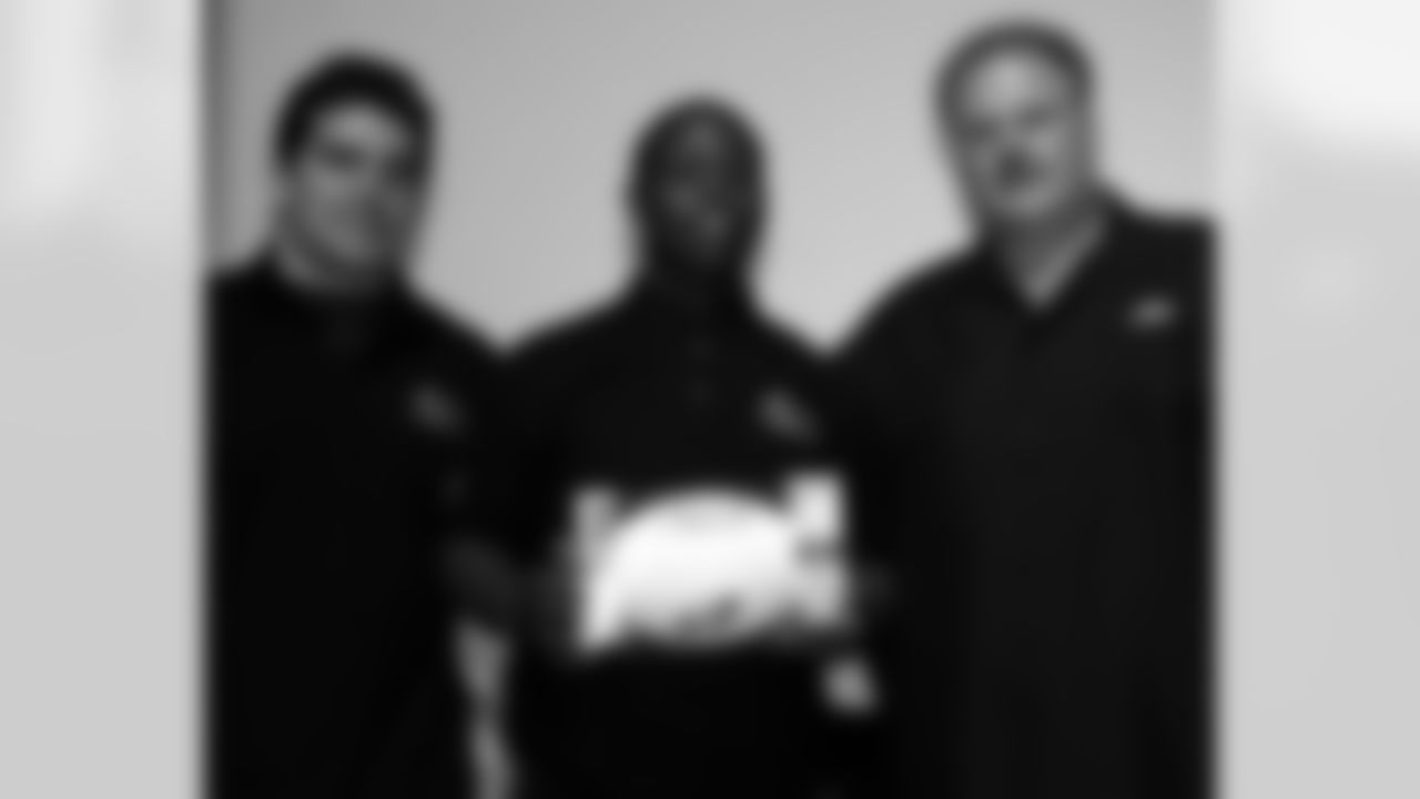 Kamal Bloodsaw of John Bartram High School with Andy Reid and Kyle Eckel