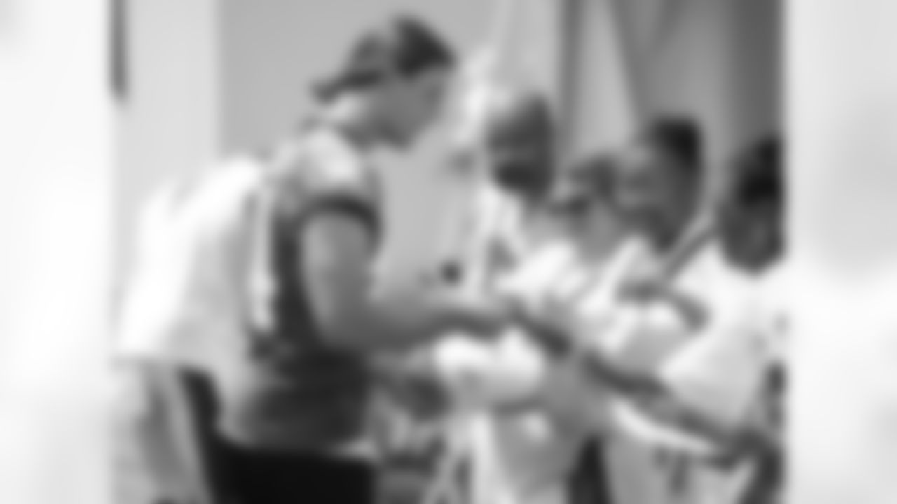 WR Riley Cooper signs some autographs after practice