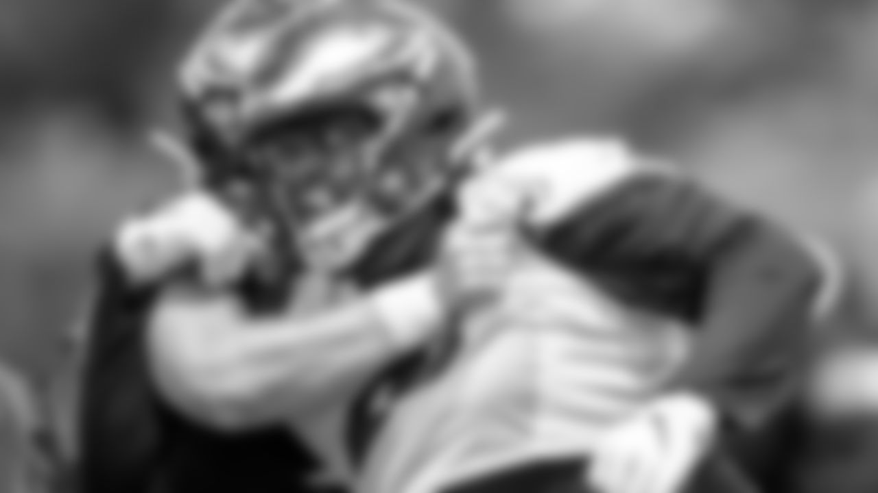 A defensive lineman fighting through a block