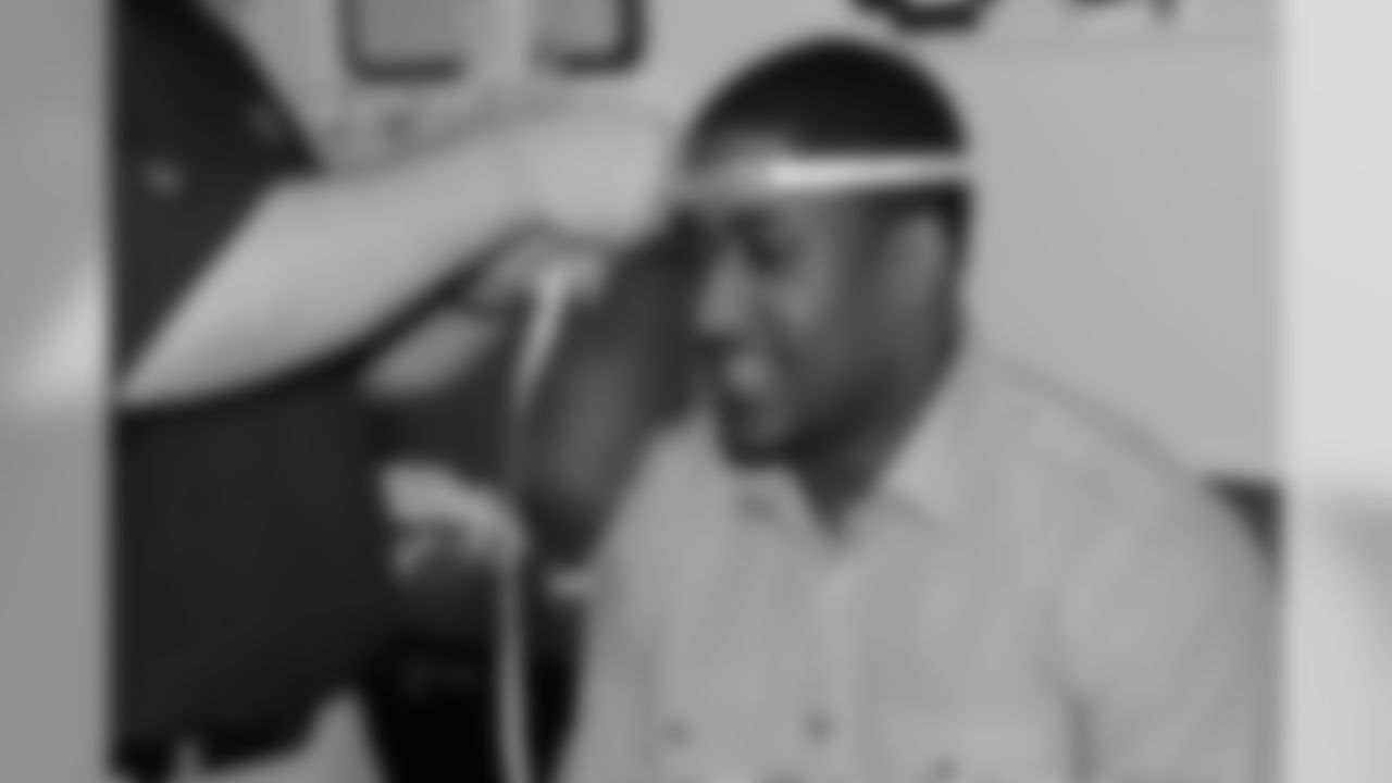 Wide receiver Marvin McNutt gets his head measured