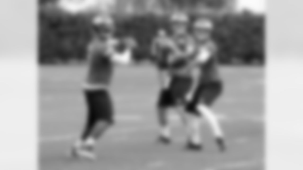 QBs Michael Vick, Matt Barkley and G.J. Kinne during receiver drills