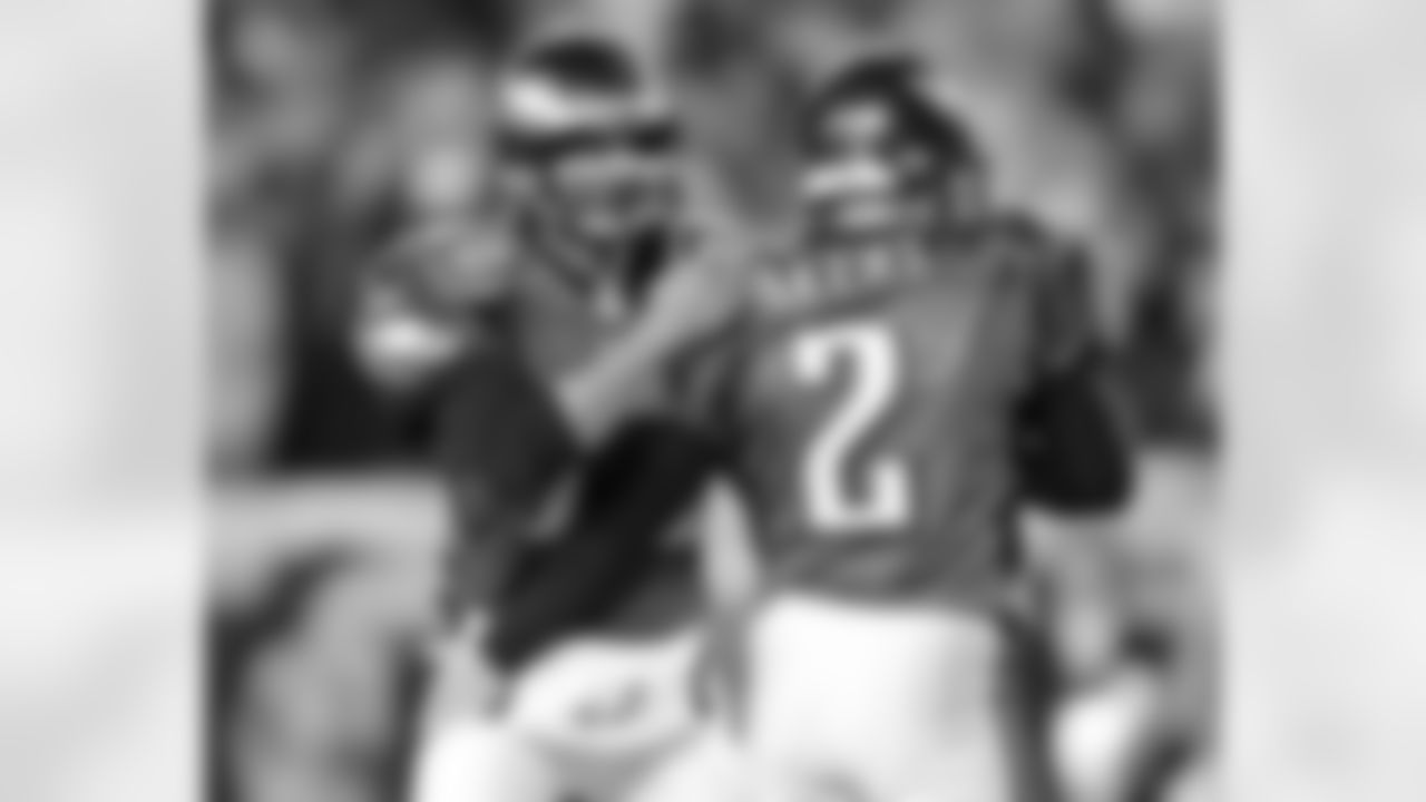QB Koy Detmer congratulates K David Akers