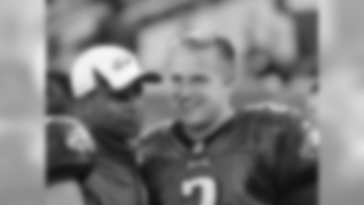 Eagles' rookie quarterback Matt Barkley talks on the sidelines with assistant defensive backs' coach Todd Lyght in Thursday's preseason game.