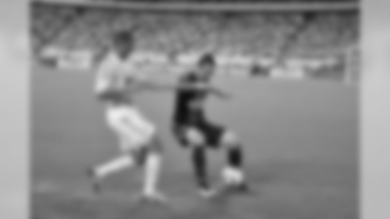 Union defender Dan Califf bozes out his opponent.