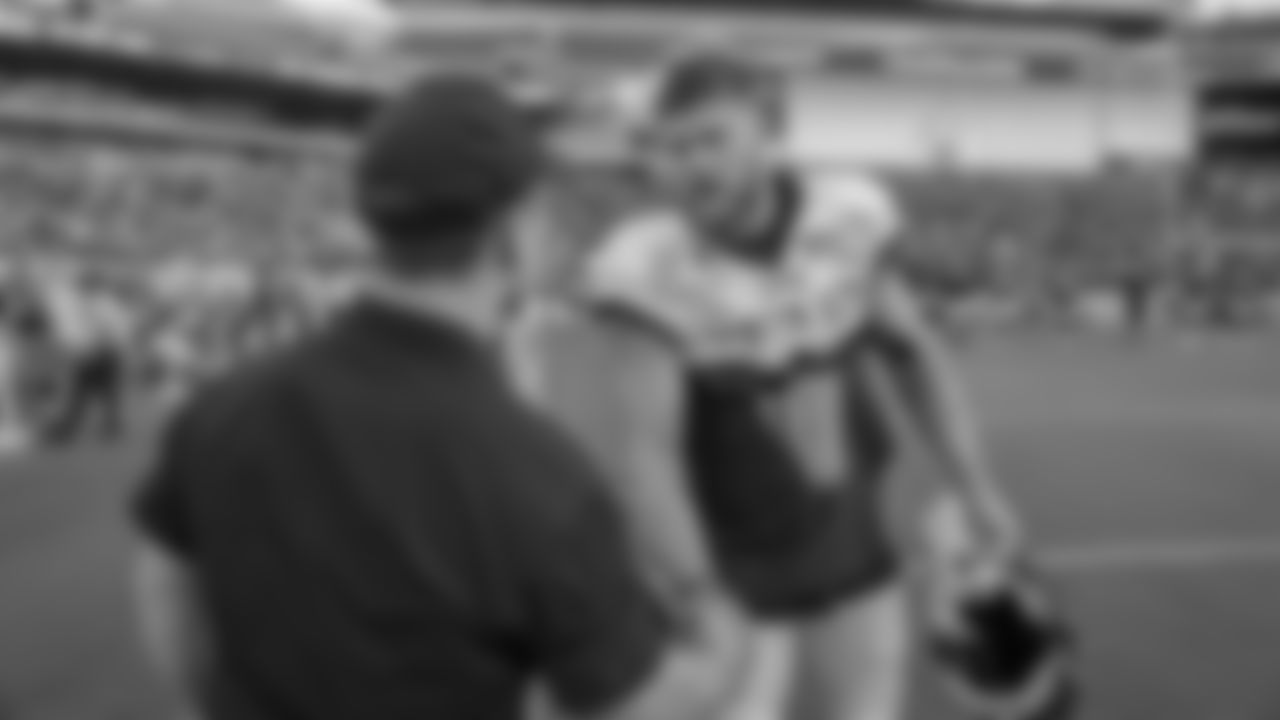 LB Nate Gerry greets a member of the military
