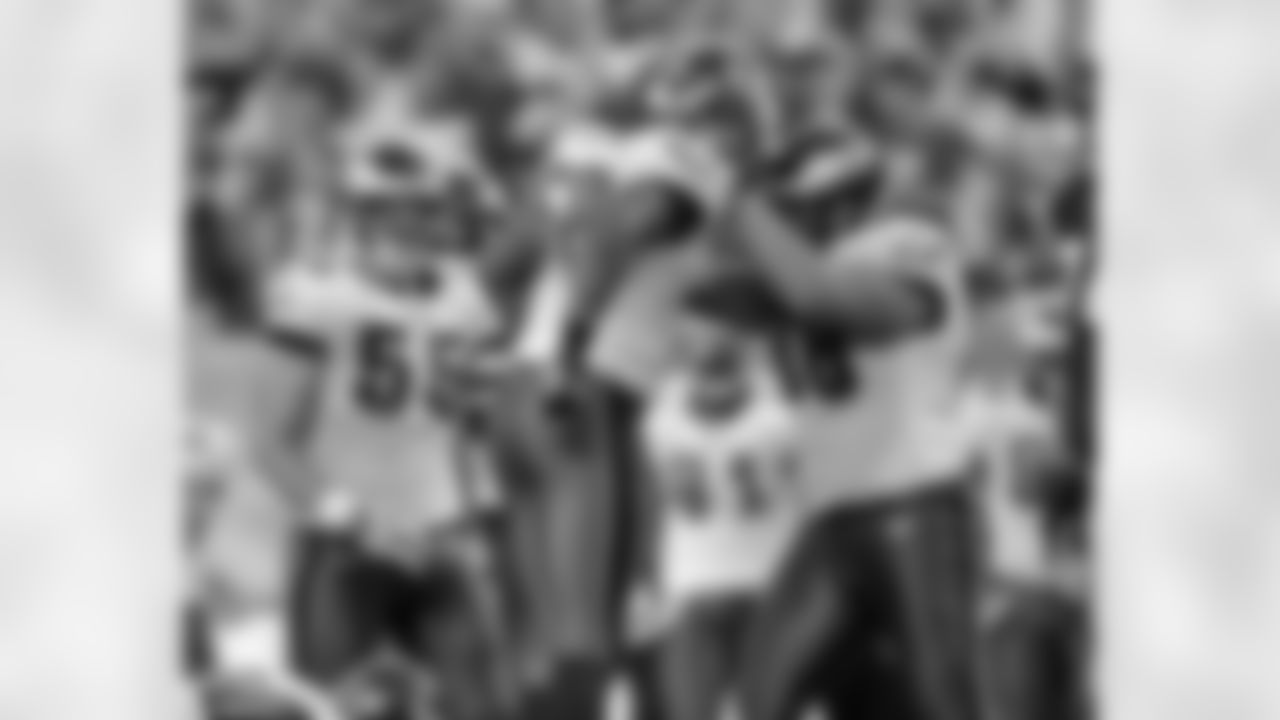 DE Trent Cole and DT Dan Klecko celebrate