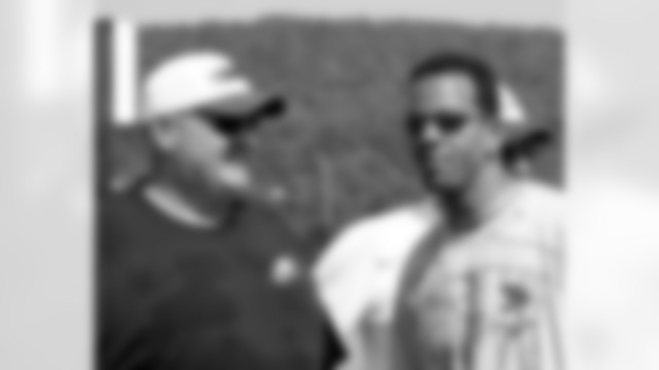 Head coach Andy Reid chats with former Bills WR Andre Reed