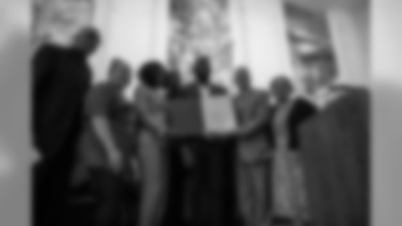 Malcolm Jenkins and his mother with members of the Camden City Council and Pastor John O. Parker (far left)