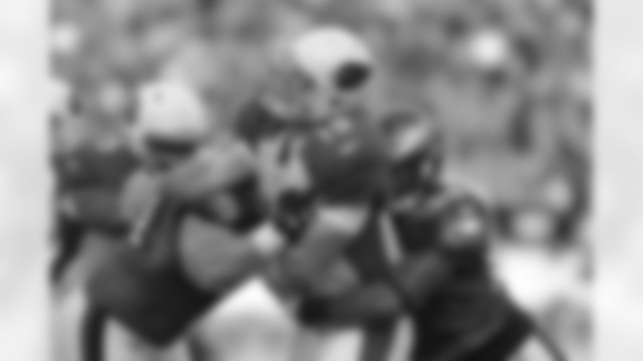 The Defensive line sacks Arizona's Quarterback
