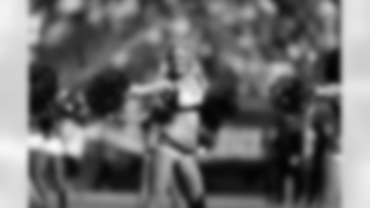 Cheerleaders show support on the sidelines.