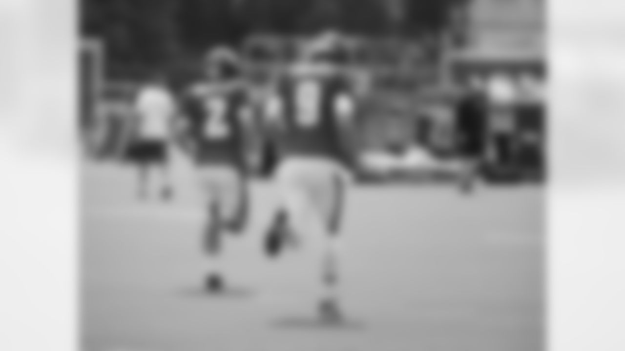 QBs Matt Barkley and Nick Foles lead the way onto the practice field