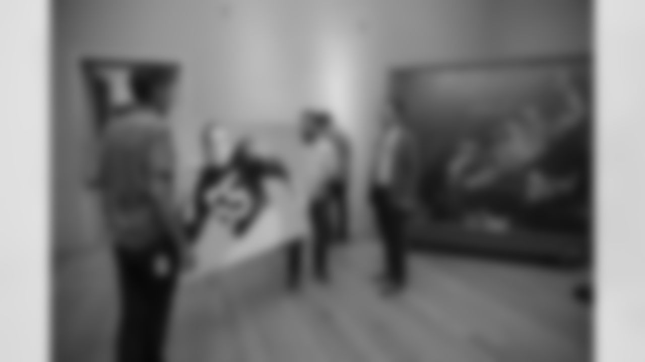 The Philadelphia Museum of Art team prepares Maxie Baughan's portrait for display