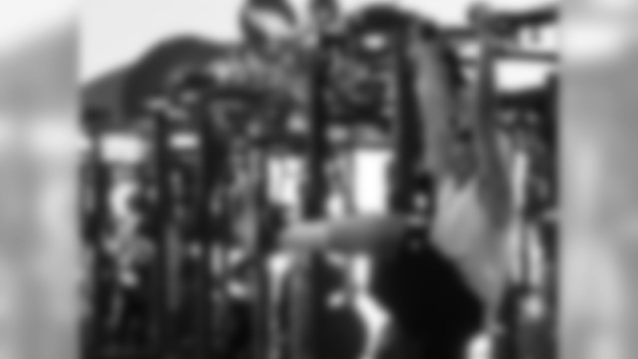 Connor Barwin testing out monkey bars for his new playground