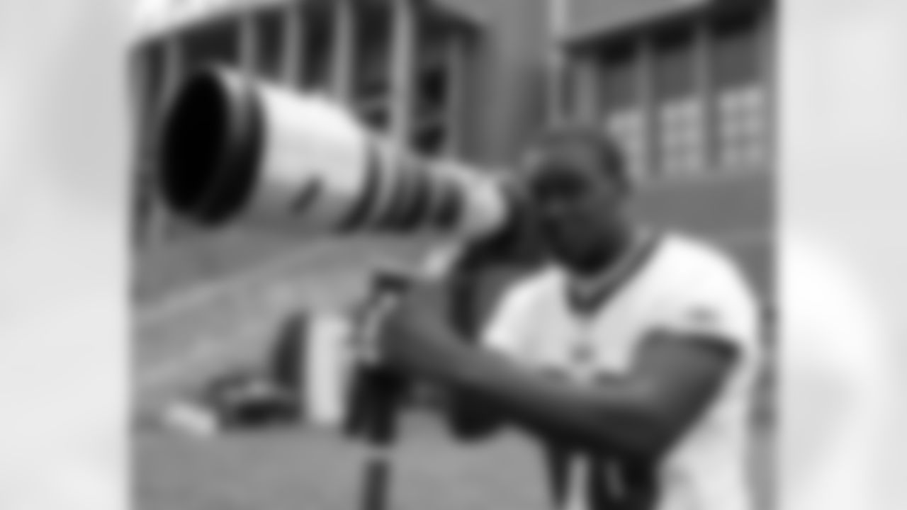 LB Omar Gaither had some fun after the June 5 practice, borrowing photographer Drew Hallowell's equipment