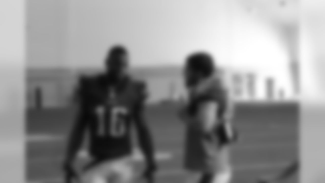 Seyi Ajirotutu and Trey Burton share a laugh