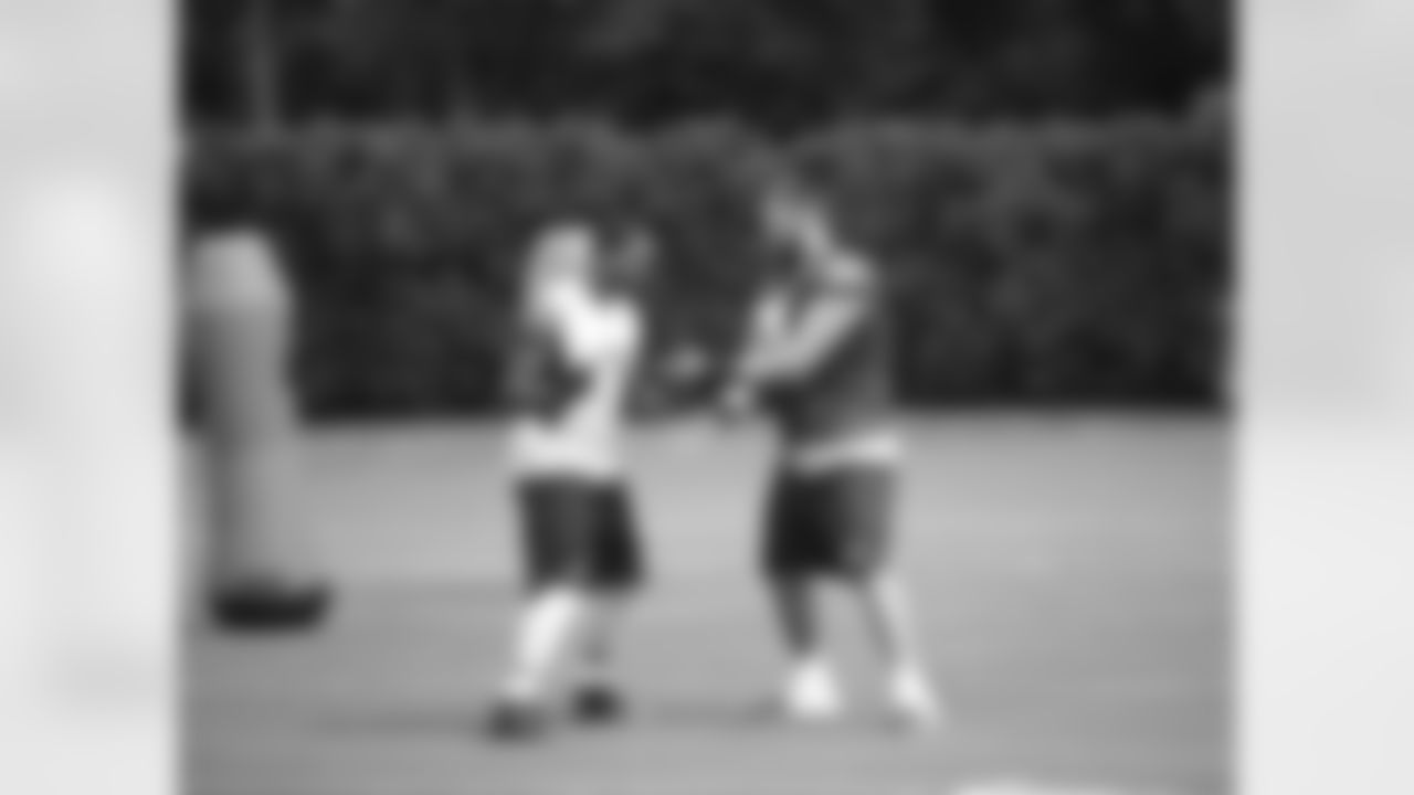 Rookies Marcus Smith II and Kevin Graf work on hand placement