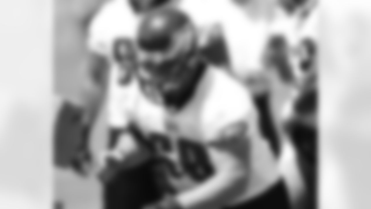 OL Mike McGlynn prepares to hit the sled