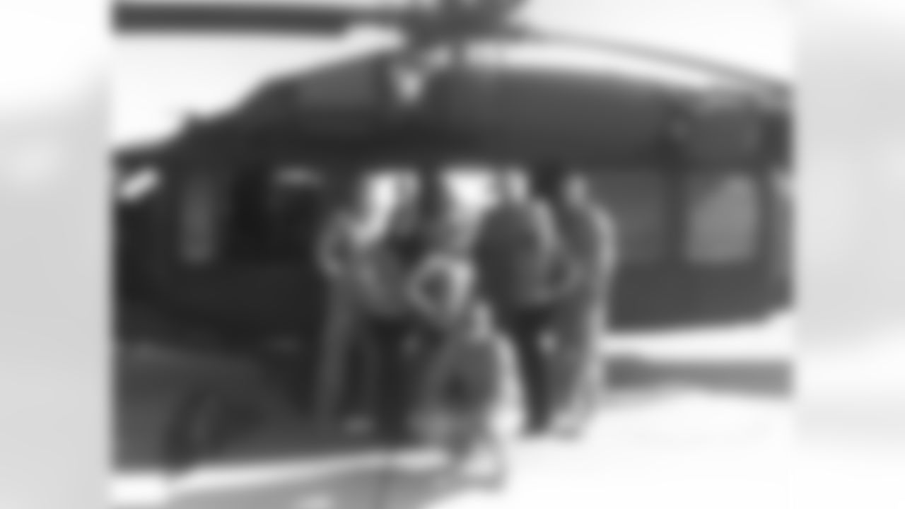 Paige, Lauren, and Casey with helicopter pilots