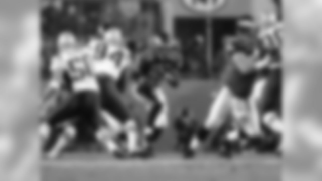 Running back Dorsey Levens finds a hole.